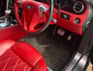 Clean car interior with polished surfaces and tidy seats.
